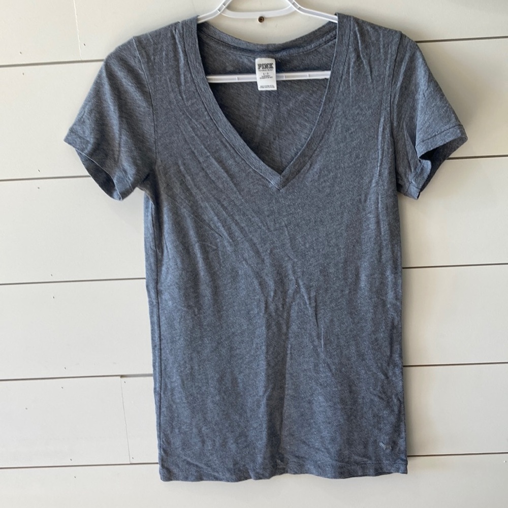 PINK. Grey short sleeve shirt.